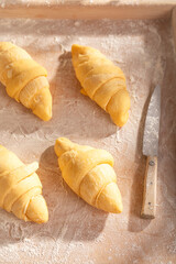 Sweet french croissants prepared on pastry board.