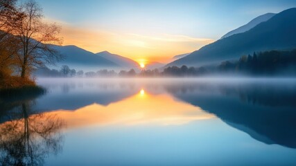 Fototapeta premium Sunrise over misty lake with mountain view