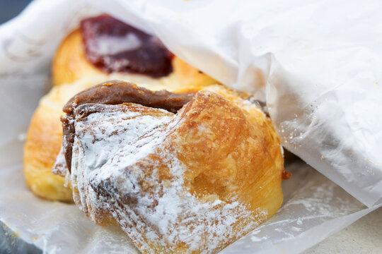 Sweet breads filled with dulce de leche, cream or membrillo jam, the breads are called facturas and are typical of Argentina.