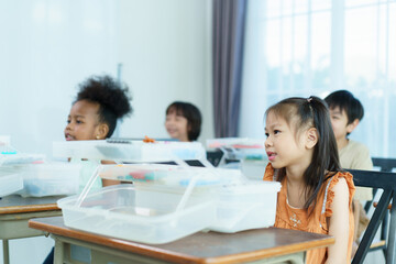 Group of diverse children enjoy learning about the STEM.