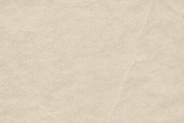 Fototapeta premium Close up of abstract texture showing beige paper surface with subtle wrinkles and natural fibers creating soft tactile feel