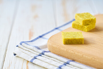 chicken bouillon cubes on a cutting board.