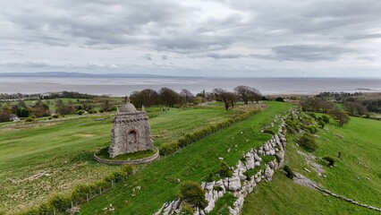 Stone Monument and Coastal Landscape in Rural England
