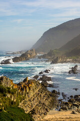 A small sheltered cove, hidden among the tall cliffs and rocks of the Tsitsikamma coastline, along the southern South African coast.