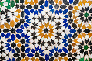 Colorful traditional Moroccan zellige mosaic from Marrakesh, featuring intricate geometric patterns, vibrant artisan craftsmanship, historic decorative design and authentic architectural heritage.
