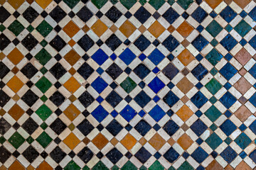 Traditional Moroccan mosaic tile pattern in Marrakesh, featuring colorful geometric design, historic craftsmanship, vibrant ornamental textures and authentic cultural architecture in ancient setting.
