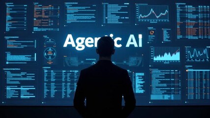 Silhouette of a man in a suit looking at a large screen displaying Agentic AI text and data visualizations, technology concept
