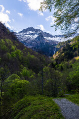 Snow-capped Pique Rouge de Bassiès Mountain in spring, seen from the hiking trail to the Ars Waterfall in Haut-Couserans, Ariège