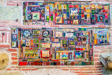 Obraz premium The closeup of mosaic tiles on the facade of Puppet Theatre, Tbilisi, Georgia.