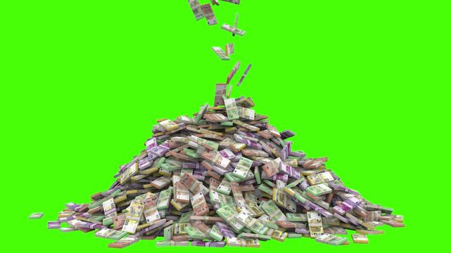 stack of euro bills falls in giant pile of euro money
