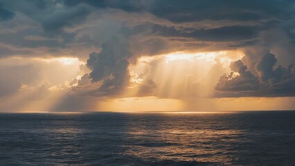 Streaks of golden sunlight breaking through storm clouds over sea Dramatic lig