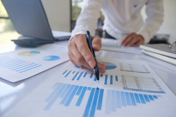 Professional businessman analyzing financial graphs investment marketing data.