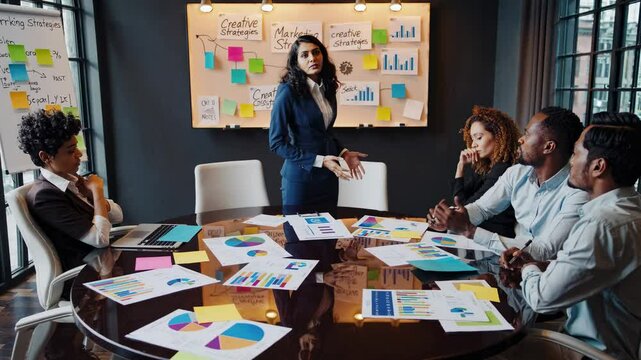 Team discusses marketing strategies during a brainstorming session in a modern office setting