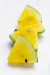 Yellow watermelon slices on white background.