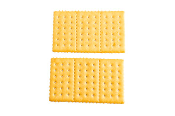 Two pieces of crackers with a white background. The crackers are yellow and have a lot of holes