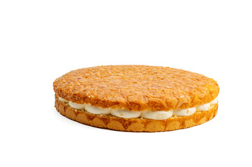 Round honey pie with almonds and white filling. The pie stands on a white background.