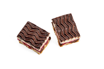 Two chocolate desserts with a swirl pattern. One is cut in half. Desserts on a white background.