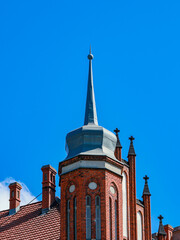 Part of an old roof, of a red brick house