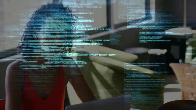 Female software developer analyzing tech code overlay at desk, blending laptop icons plus mug