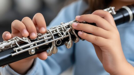 Young man plays clarinet indoors, showcasing musical talent while surrounded by soft light and home decor