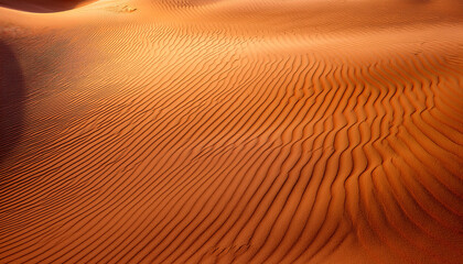 golden sand dunes texture with wavy desert patterns sunlit ripples and warm earthy terracotta tones for natural background