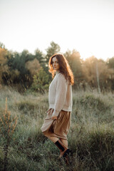 Woman enjoying peaceful walk in autumn field