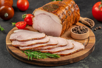 Sliced smoked pork loin on a wooden board