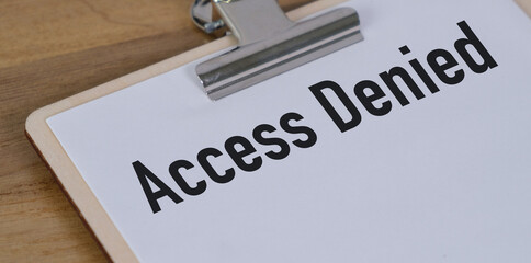 A clip board with the word Access Denied written on it