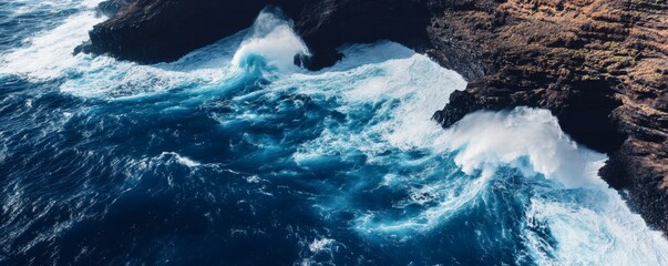 Powerful waves crashing against a rocky shoreline.