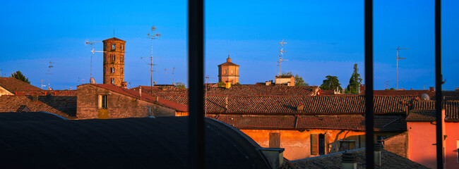 Ravenna, Italy landmark architecture rooftop window aerial view with tile roofs and stone towers...