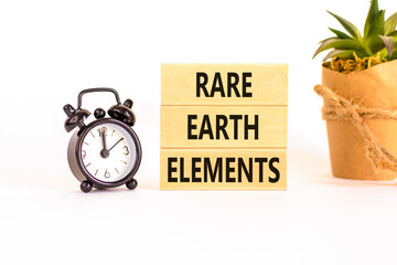 Rare earth elements symbol. Concept words Rare earth elements on beautiful wooden block. Black...