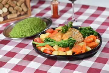 codfish typical Portuguese dish baked cod with onion garlic peppers and potatoes rustic Portuguese food salted fish cooked olive oil