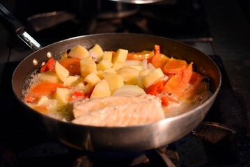 typical portuguese dish roasted codfish with onion garlic peppers and rustic babata lusitanian food