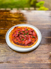 An appealing dish of salsa served alongside crispy chips, offering a colorful and flavorful dipping experience.