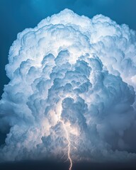 A massive cloud formation with a striking bolt of lightning illuminates the dramatic sky.