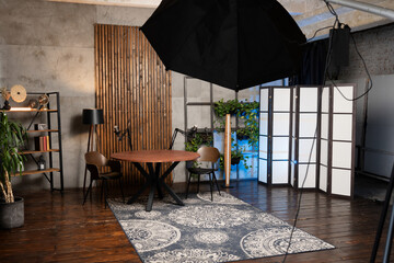 Podcast studio setup featuring microphone and interview space with modern decor and live broadcast equipment