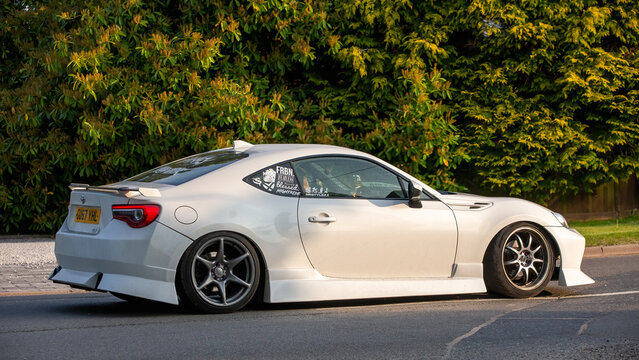 Whittlebury,Northants.,.UK - April 27th 2025:  2017 white Toyota gt86 car driving on an English country road.