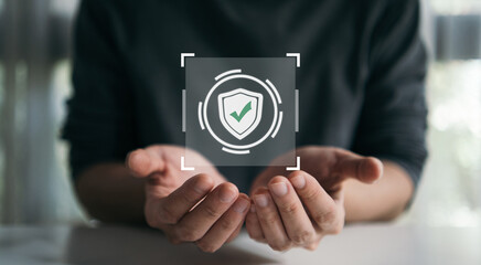 Hand holding digital check mark icon, representing online verification, security approval, and success in a digital technology environment. Guarantee quality standard concept