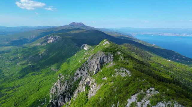 Aerial view of Sisol peak near Brseč, offering stunning views of Učka(Ucka) Nature Park, the Adriatic Sea, and Rijeka city. A beautiful hiking destination on the eastern coast of Istria, Croatia