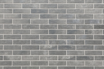 A gray brick wall with a gray brick pattern