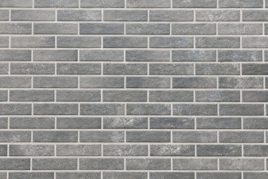 Fototapeta A gray brick wall with a gray brick pattern