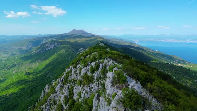 Aerial view of Sisol peak near Brseč, offering stunning views of Učka(Ucka) Nature Park, the Adriatic Sea, and Rijeka city. A beautiful hiking destination on the eastern coast of Istria, Croatia