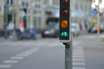 Green bicycle traffic light on a road