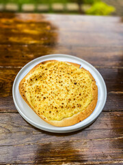A vibrant plate of cheesy pasta, showcasing its golden color and rich texture, perfect for a cozy meal.