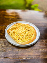 Close-up of a delicious pasta dish topped with melted cheese, creating an inviting and hearty meal option.