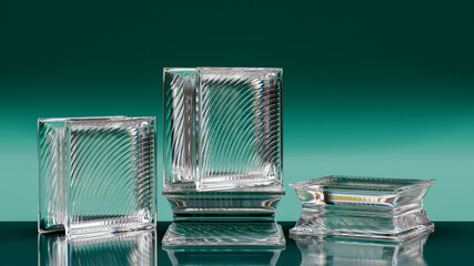 Group of transparent glass blocks against a turquoise background. Capturing abstract patterns and light distortion. Building assortment for home, bathroom and office.