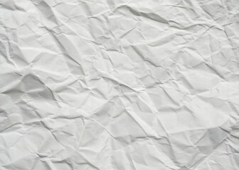 Obraz premium Crumpled white paper texture on a clean, blank surface, featuring wrinkles against a white background.