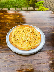 A delightful serving of pasta, featuring a blend of fresh ingredients and cheeses, making it an ideal meal for any occasion.