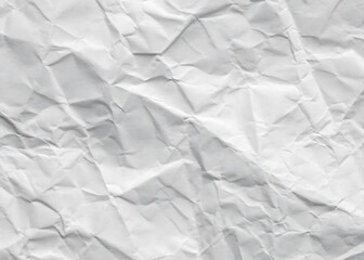 Obraz premium Crumpled white paper texture on a clean, blank surface, featuring wrinkles against a white background.