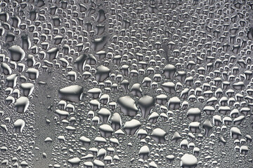 background, unusual, abstract. drops of morning dew, condensation on the glass. wet glass. water drops close-up. beautiful background for text. Spray cool condensate water on the glas